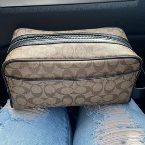 Coach bag with hockey teams inside.